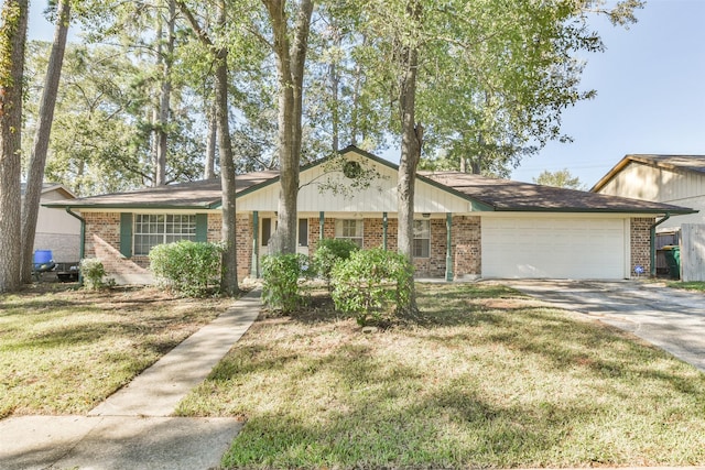 view of front facade featuring brick siding, an attached garage, concrete driveway, and a front yard