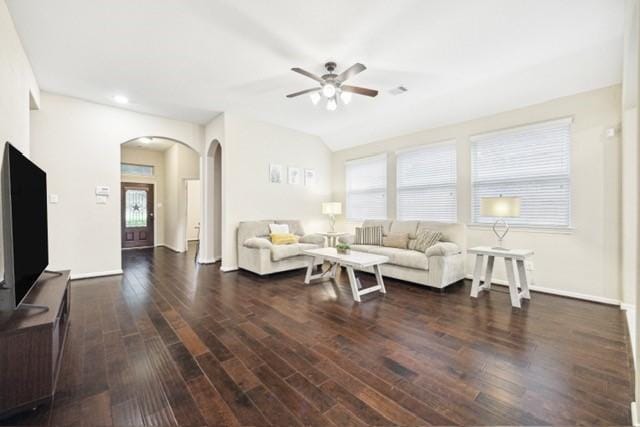 living room with ceiling fan, dark hardwood / wood-style flooring, and lofted ceiling