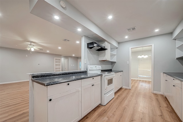 kitchen featuring light wood-type flooring, ceiling fan with notable chandelier, wall chimney range hood, white cabinets, and white range with electric cooktop