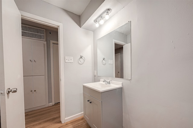 bathroom featuring vanity and wood-type flooring