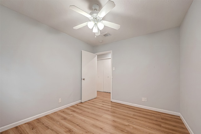 unfurnished room featuring ceiling fan and light wood-type flooring