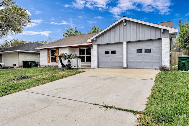 ranch-style home with a front yard and a garage