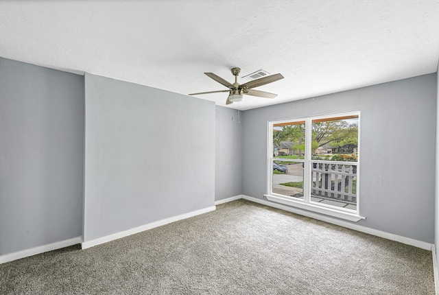 unfurnished room with ceiling fan and carpet flooring