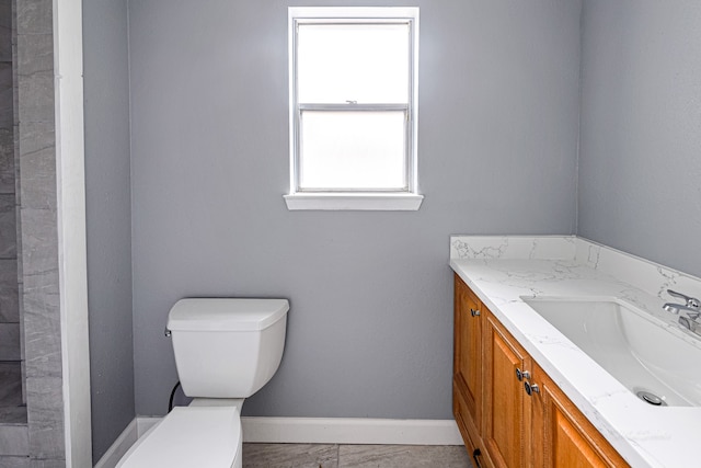 bathroom featuring toilet and vanity