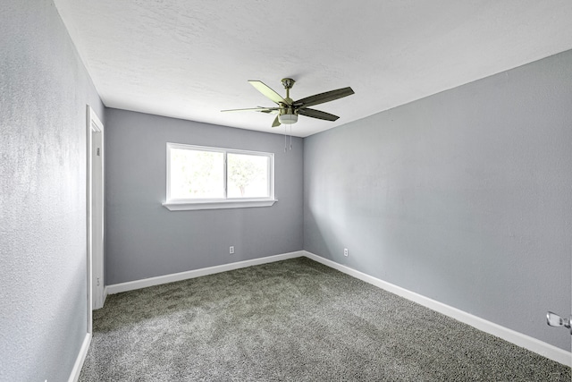 empty room with carpet floors and ceiling fan