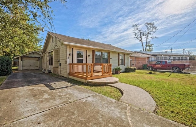 view of front facade featuring a garage, an outdoor structure, and a front lawn