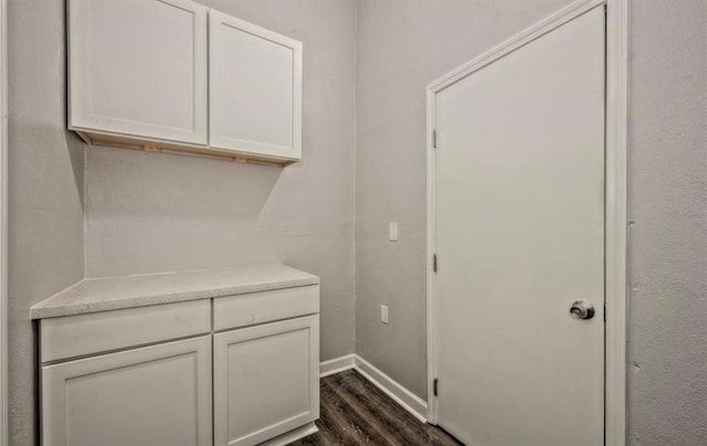 interior space with dark wood-type flooring