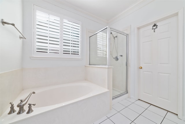 bathroom with tile patterned floors, crown molding, and shower with separate bathtub