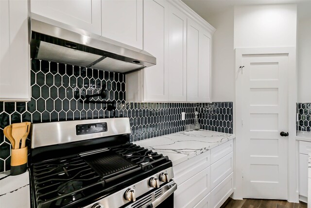 kitchen featuring white cabinetry, tasteful backsplash, stainless steel gas range oven, dark hardwood / wood-style flooring, and range hood