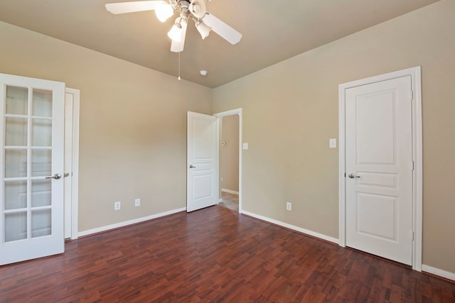 unfurnished room with dark wood-type flooring and ceiling fan