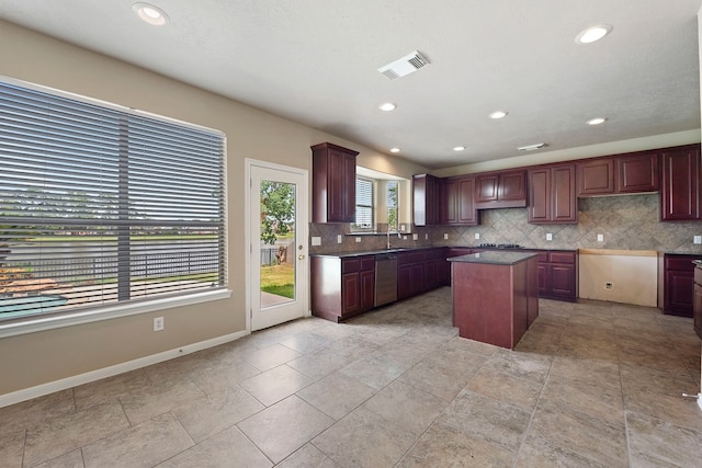 kitchen with sink, a center island, stainless steel dishwasher, black gas cooktop, and backsplash