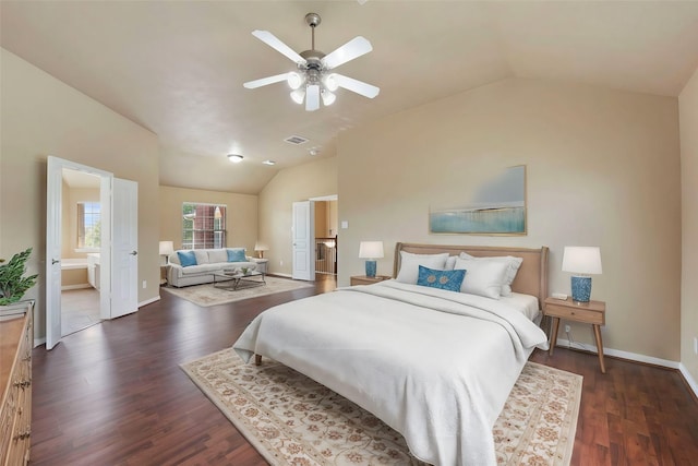 bedroom with lofted ceiling, ensuite bath, dark hardwood / wood-style floors, and ceiling fan