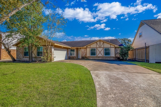 view of front of property featuring a front yard and a garage