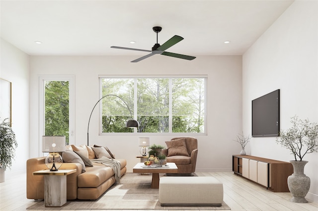 living area with light wood-style floors, recessed lighting, a ceiling fan, and a wealth of natural light