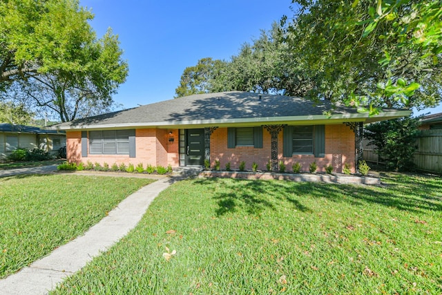 ranch-style house with a front lawn