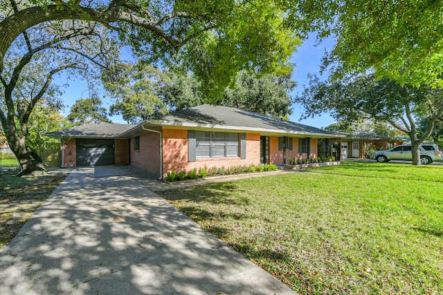 single story home with a garage and a front lawn