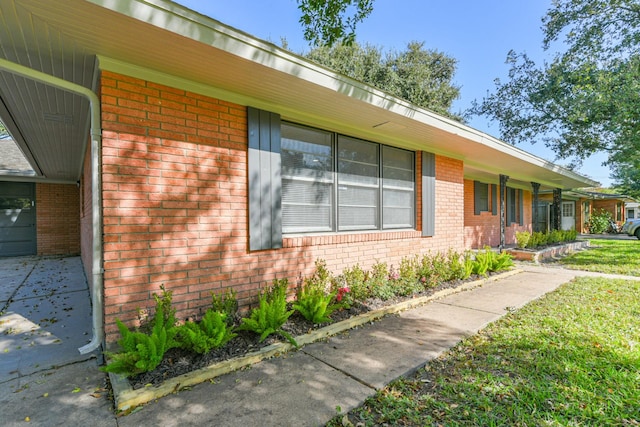 view of home's exterior with a lawn