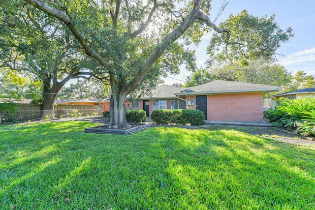 ranch-style house with a front lawn