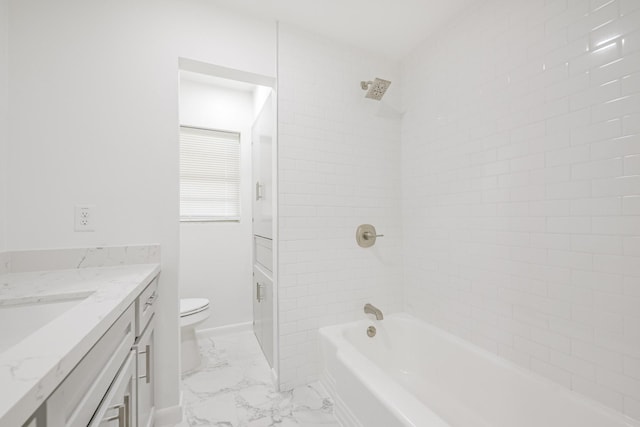 full bathroom with vanity, toilet, and tiled shower / bath combo