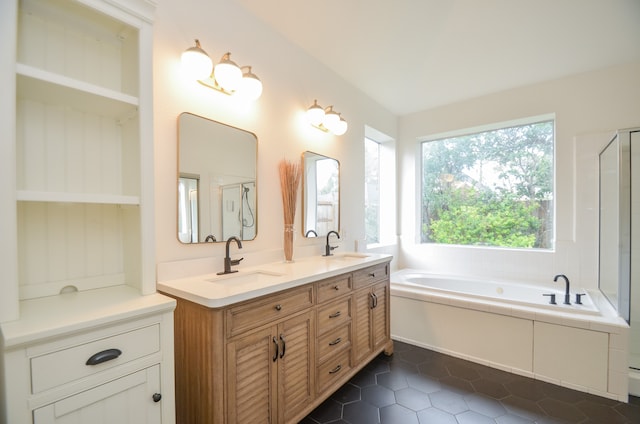 bathroom with separate shower and tub, tile patterned flooring, and vanity