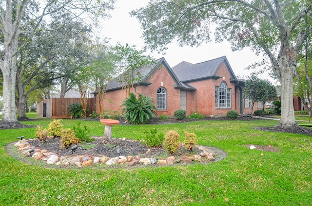 view of side of property featuring a lawn