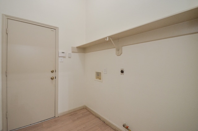 washroom with hookup for a gas dryer, hookup for an electric dryer, washer hookup, and light wood-type flooring