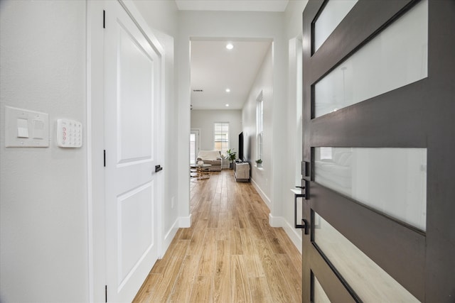 hallway featuring light wood-type flooring