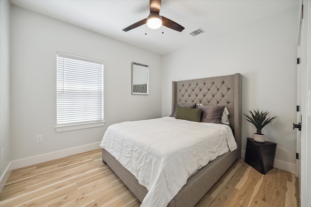 bedroom with light wood-type flooring and ceiling fan