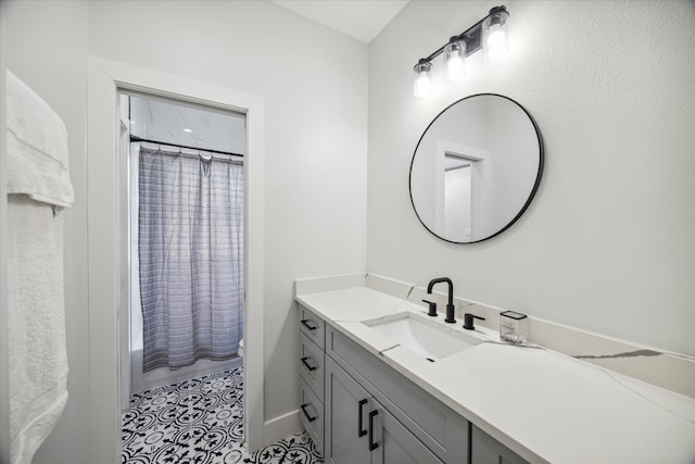 bathroom with tile patterned flooring, vanity, and shower / bath combination with curtain