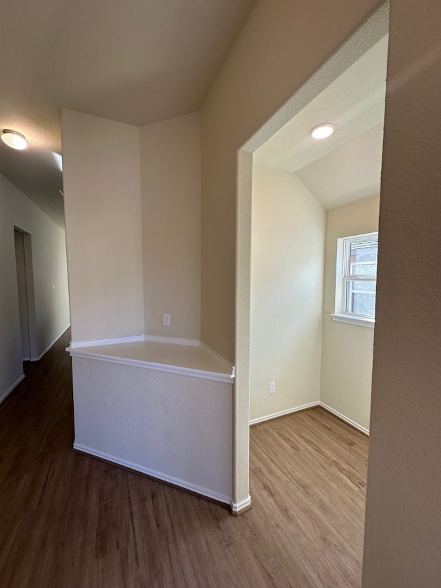 empty room with hardwood / wood-style floors