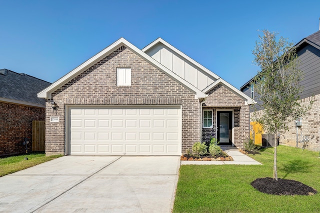 front of property with a front yard and a garage