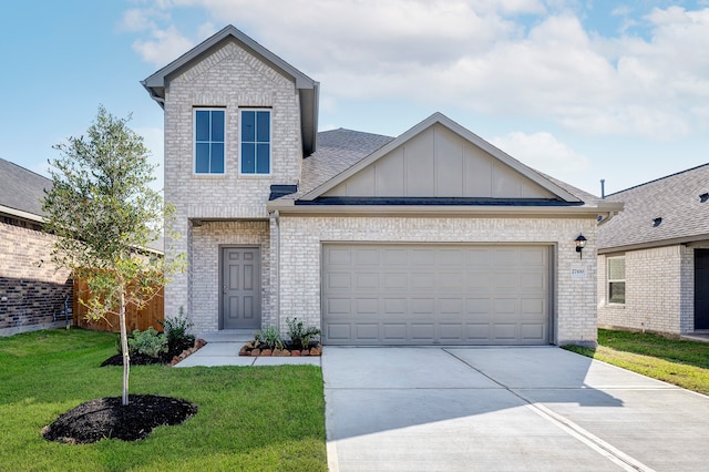 view of front of property featuring a garage and a front lawn