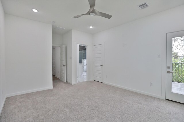9339 Lavender St, North Houston, TX 77016 - unfurnished bedroom with light colored carpet, access to outside, baseboards, recessed lighting, and connected bathroom