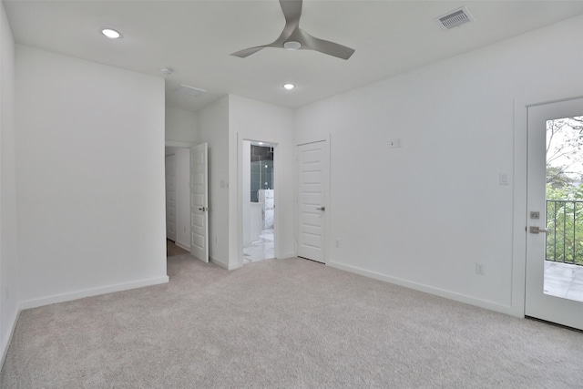 9339 Lavender St, North Houston, TX 77016 - spare room featuring light colored carpet, a ceiling fan, and recessed lighting
