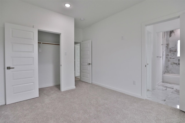 9339 Lavender St, North Houston, TX 77016 - unfurnished bedroom featuring a closet, carpet, ensuite bathroom, and recessed lighting