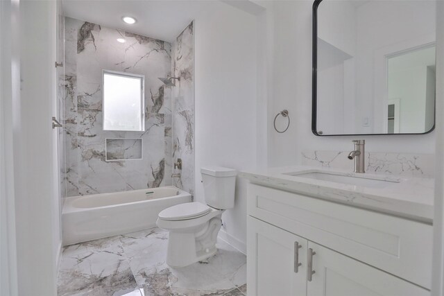 9339 Lavender St, North Houston, TX 77016 - bathroom with vanity, toilet, baseboards, shower / bath combination, and marble finish flooring