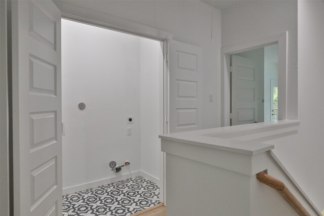 9339 Lavender St, North Houston, TX 77016 - laundry room with electric dryer hookup, gas dryer hookup, and tile patterned flooring