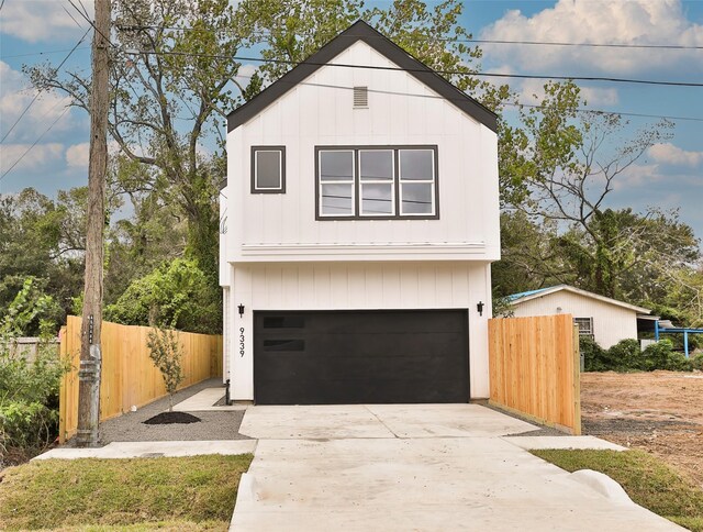 9339 Lavender St, North Houston, TX 77016 - view of front of house featuring a garage and concrete driveway
