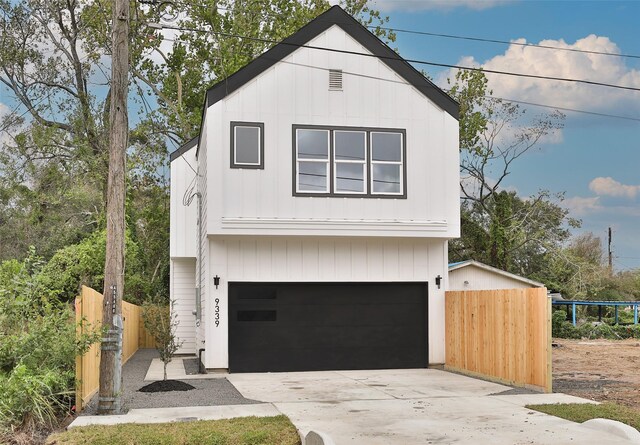 9339 Lavender St, North Houston, TX 77016 - view of front of property featuring an attached garage and concrete driveway