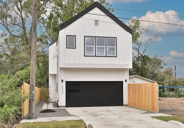 9339 Lavender St, North Houston, TX 77016 - view of front of house with a garage and driveway