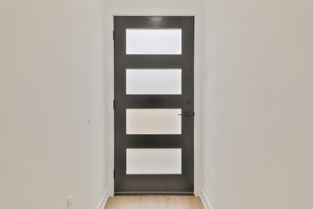 9339 Lavender St, North Houston, TX 77016 - entryway with baseboards and light wood-type flooring