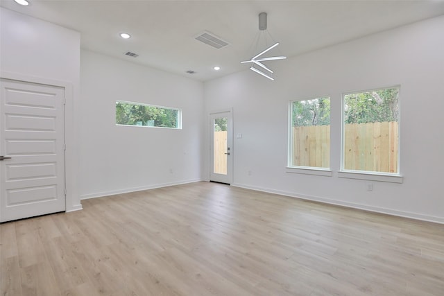 9339 Lavender St, North Houston, TX 77016 - spare room featuring healthy amount of natural light, light wood finished floors, and recessed lighting