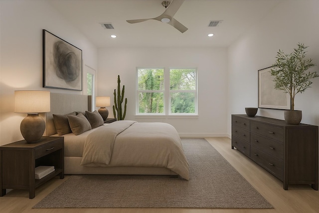9339 Lavender St, North Houston, TX 77016 - bedroom with light wood-type flooring, recessed lighting, and ceiling fan