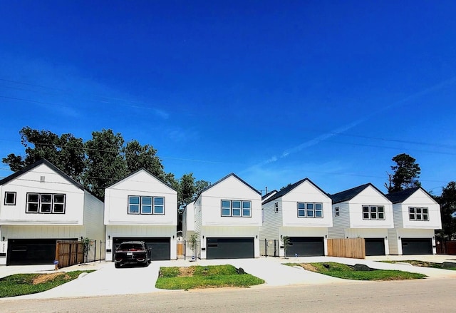9339 Lavender St, North Houston, TX 77016 - modern farmhouse featuring a garage and concrete driveway