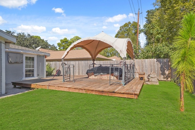 wooden deck with a lawn