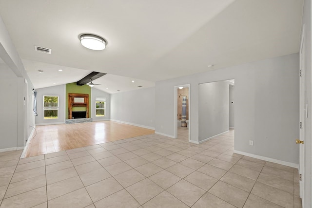 unfurnished living room with lofted ceiling with beams, light hardwood / wood-style floors, and ceiling fan