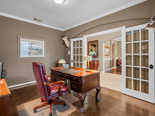 office space with french doors, ornamental molding, a textured ceiling, and hardwood / wood-style flooring