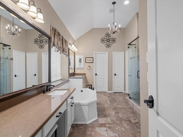 bathroom featuring vanity, separate shower and tub, and a notable chandelier