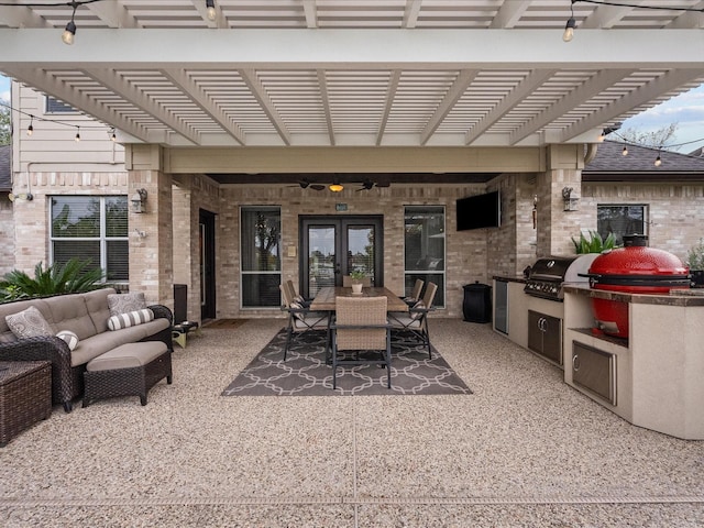 view of patio with a pergola, outdoor lounge area, ceiling fan, exterior kitchen, and a grill