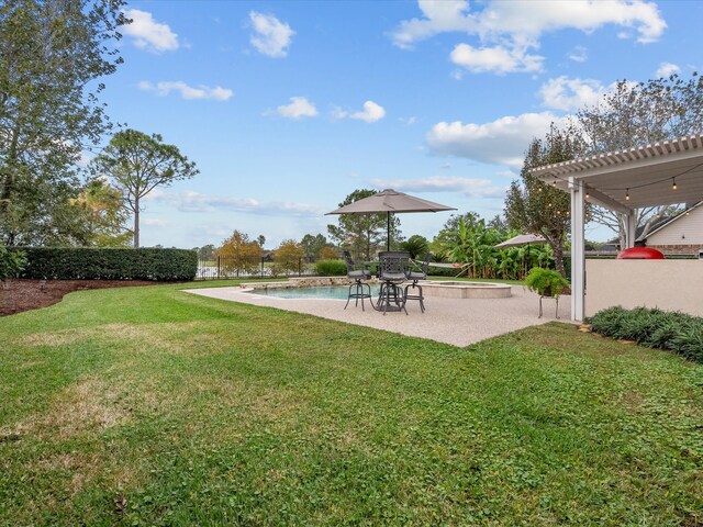 view of yard with a fenced in pool and a patio